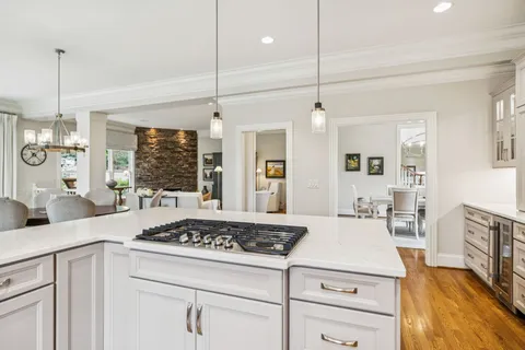 a living room with furniture and large windows