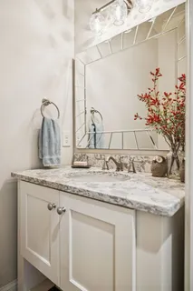 a bedroom with a bed couch and window