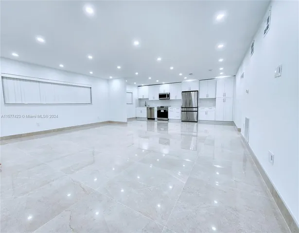 a view of a kitchen with a stove and a cabinets