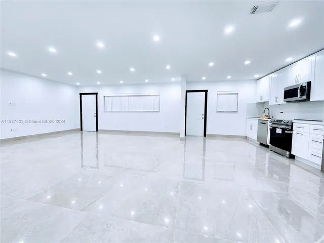 a view of a big room with an empty space