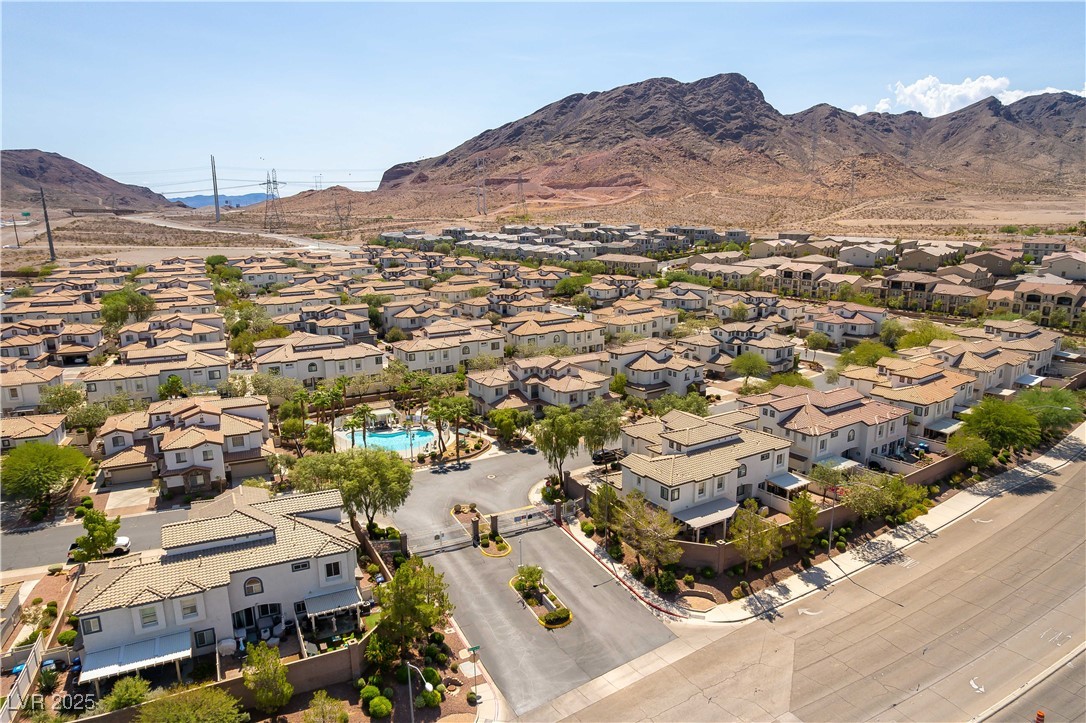 1109 Tropical Star Lane, Unit 1 Henderson, NV 89002 - Photo 2 of 41 Front the Gated Entrance You Are Greeted by The Resort Style Community Pool and Lush Grounds
