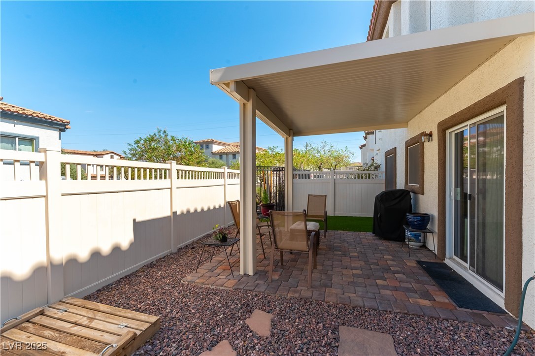1109 Tropical Star Lane, Unit 1 Henderson, NV 89002 - Photo 25 of 41 Largest Lot-Covered Paver Patio with Synthetic Grass Space