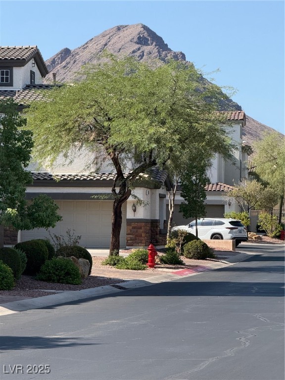 1109 Tropical Star Lane, Unit 1 Henderson, NV 89002 - Photo 3 of 41 The Entire Community is Surrounded by Moountain Peaks and Lush Trees and Lanscaping
