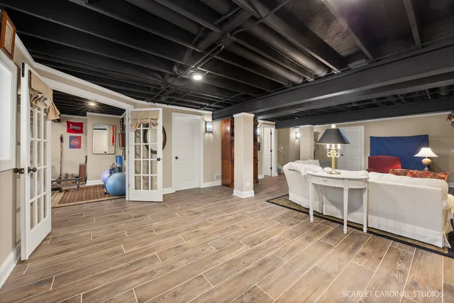 a view of a room with wooden floor