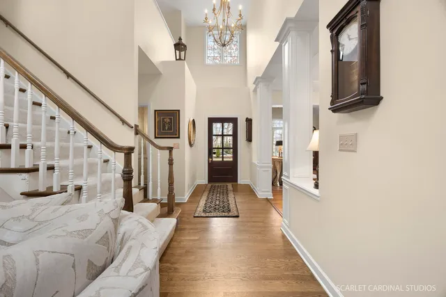 a view of entryway and hall with wooden floor