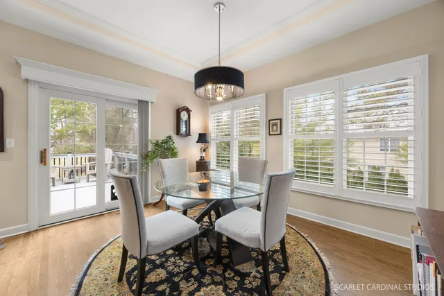 a dining room with furniture window wooden floor