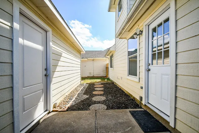 a view of a house with a backyard