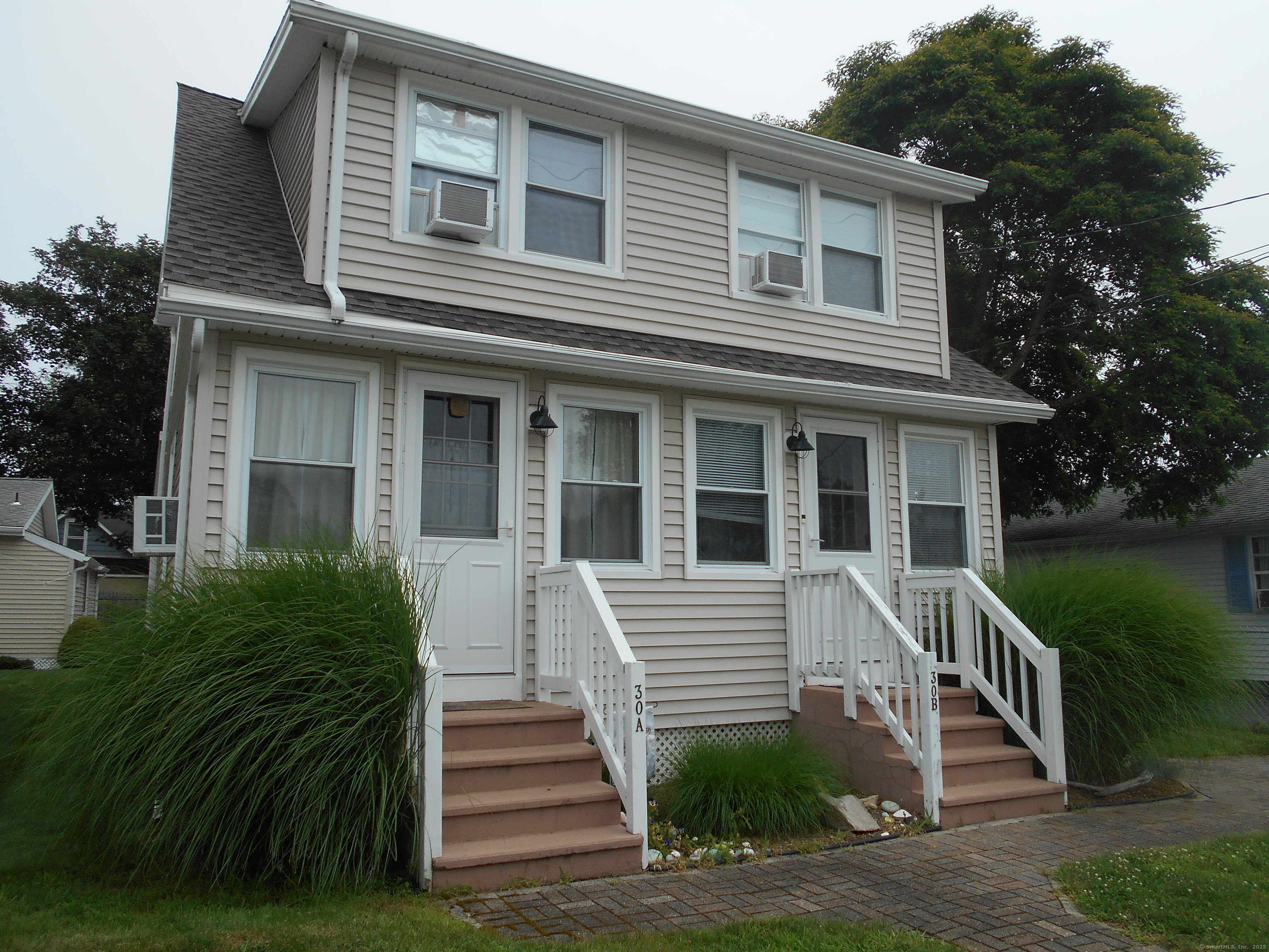 30 Hartford Avenue, Unit B Old Saybrook, CT 06475 - Photo 1 of 23 a view of a house with a yard and stairs