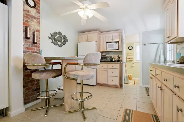 a kitchen with cabinets and appliances