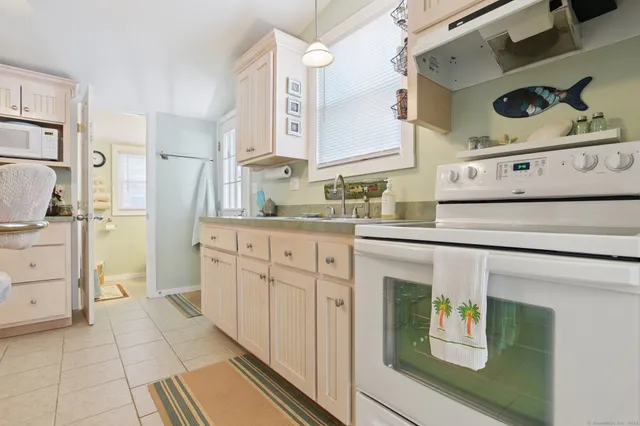 a kitchen with stainless steel appliances a refrigerator and cabinets