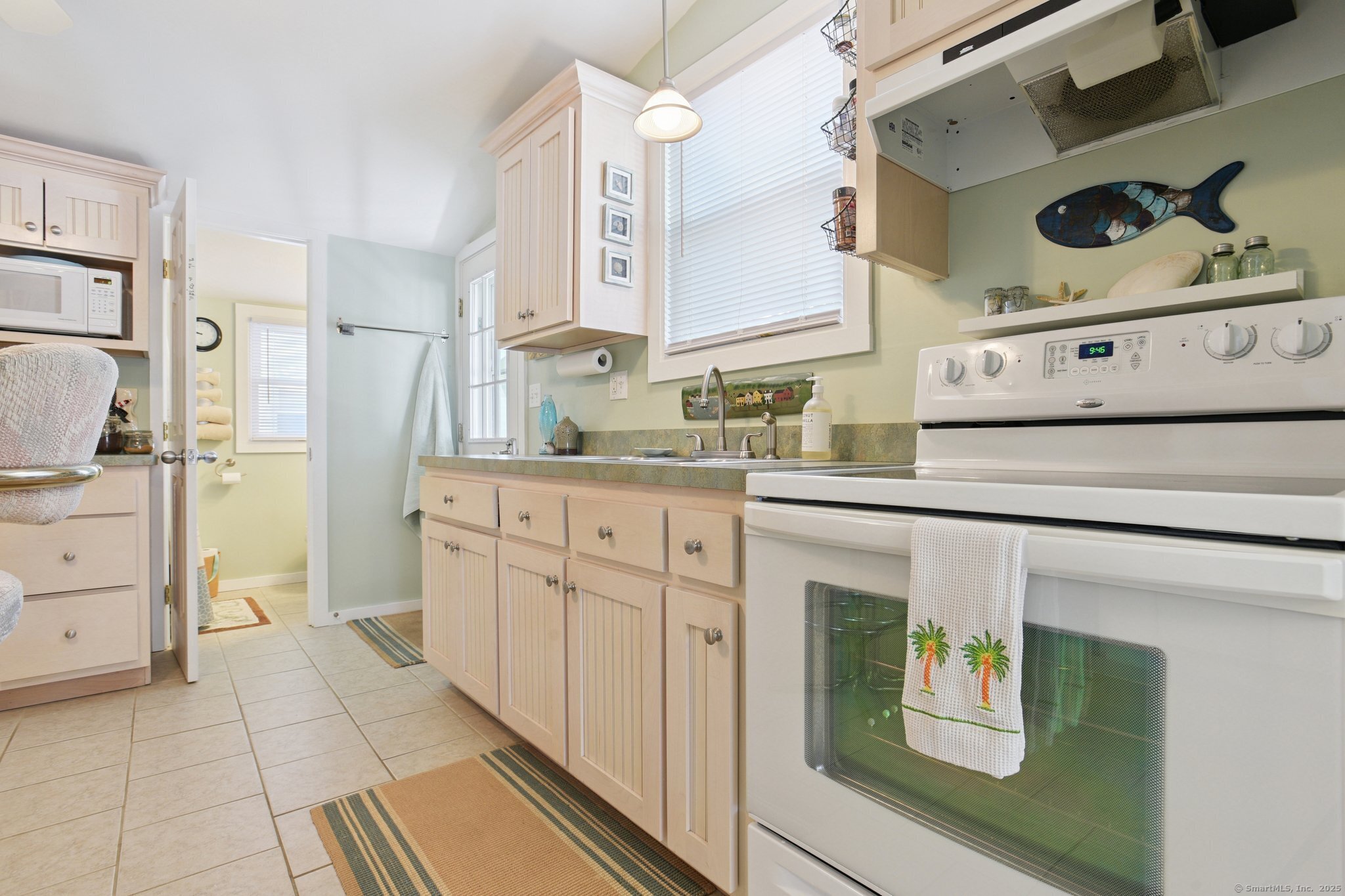 30 Hartford Avenue, Unit B Old Saybrook, CT 06475 - Photo 12 of 23 a kitchen with cabinets and appliances