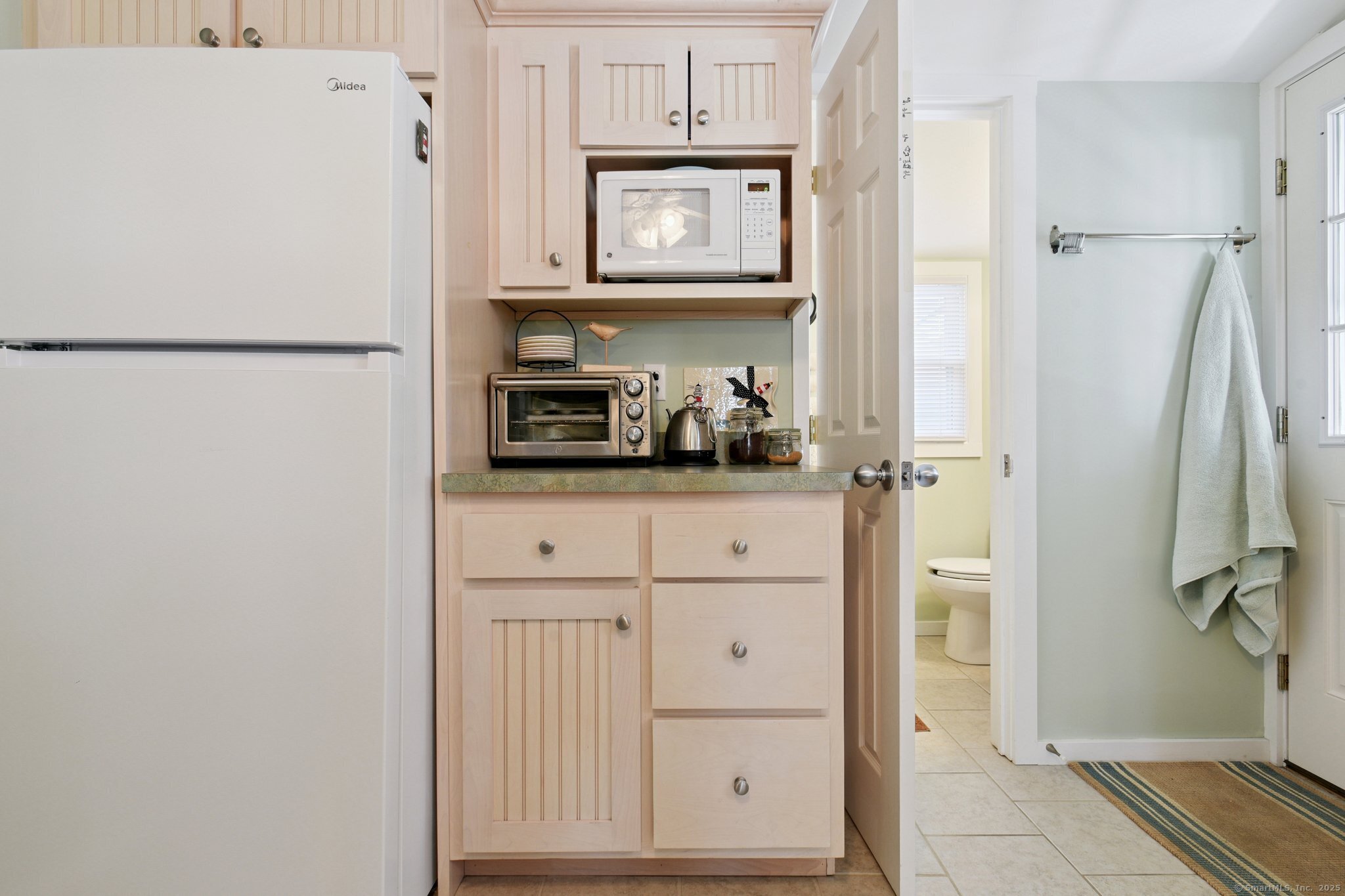 30 Hartford Avenue, Unit B Old Saybrook, CT 06475 - Photo 13 of 23 a kitchen with stainless steel appliances a refrigerator and cabinets