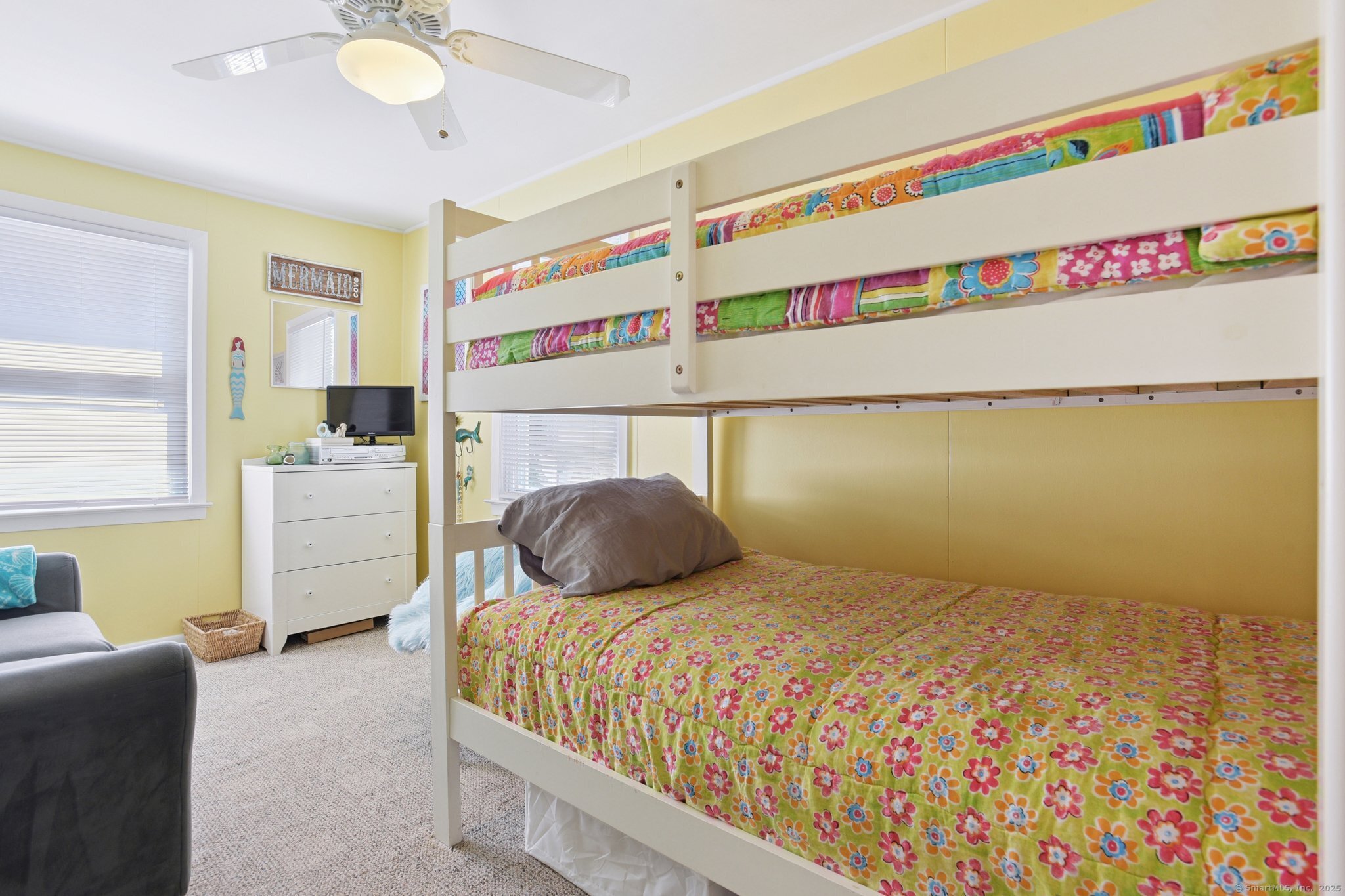 30 Hartford Avenue, Unit B Old Saybrook, CT 06475 - Photo 18 of 23 a bedroom with a bed and a dresser