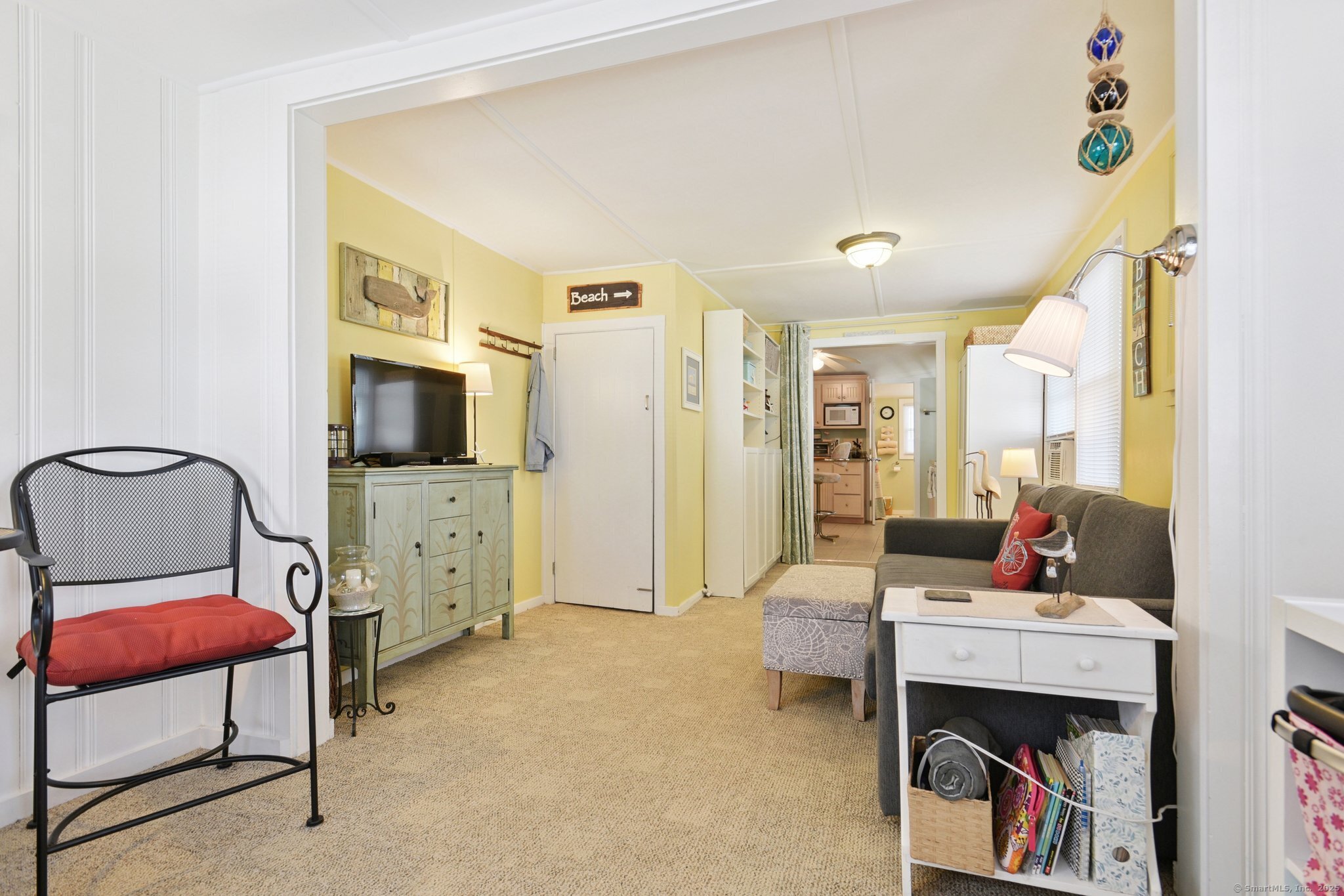 30 Hartford Avenue, Unit B Old Saybrook, CT 06475 - Photo 4 of 23 a living room with furniture and a flat screen tv