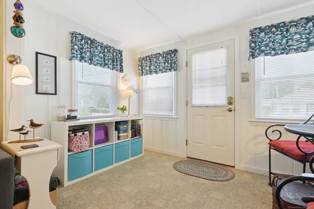 a kitchen with a refrigerator and a stove top oven