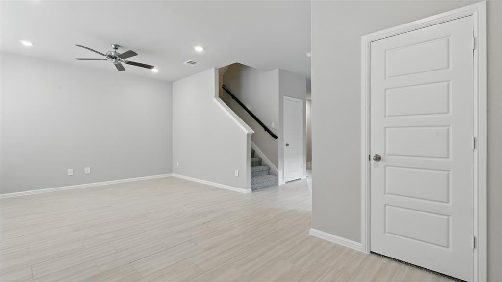 3149 Maple Orch Lane Fort Worth, TX 76140 - Photo 10 of 39 wooden floor in an empty room with a window