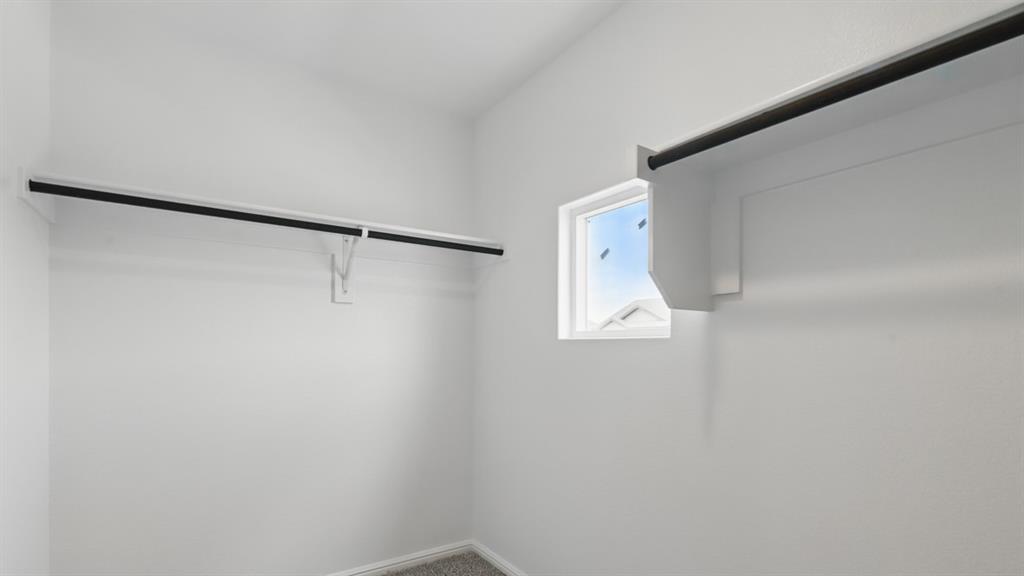 3149 Maple Orch Lane Fort Worth, TX 76140 - Photo 26 of 39 a bathroom with a shower and a window