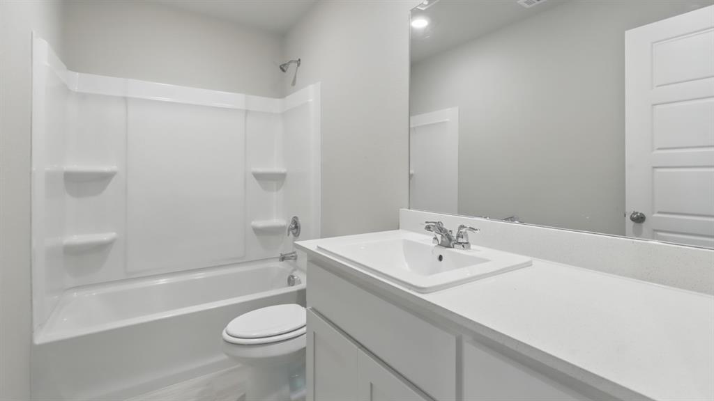 3149 Maple Orch Lane Fort Worth, TX 76140 - Photo 31 of 39 a bathroom with a sink a toilet and shower