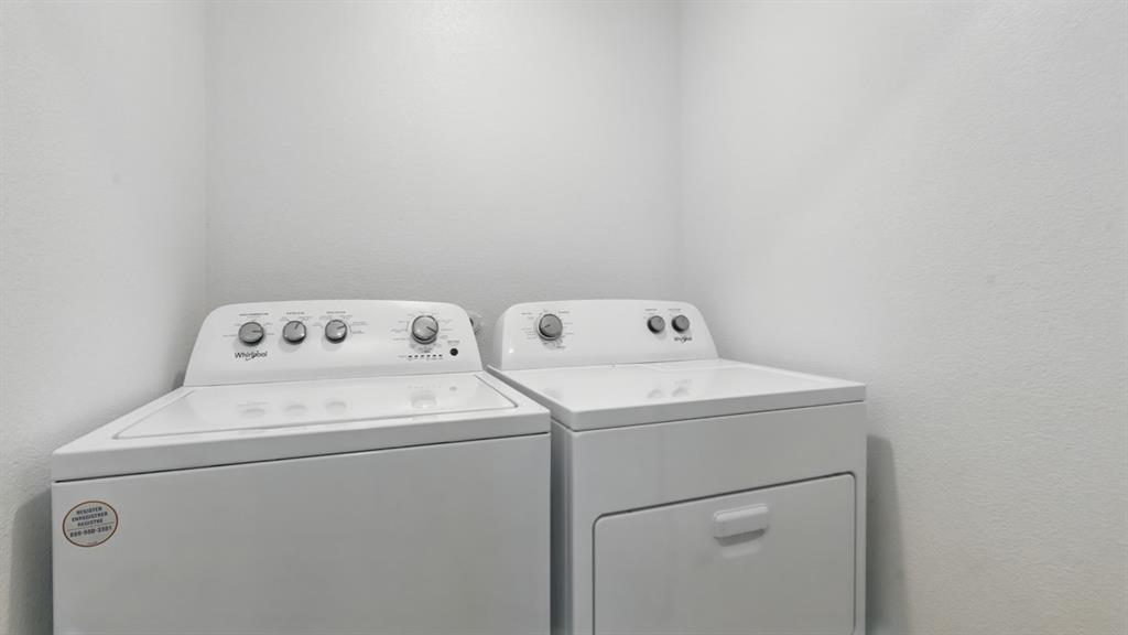 3149 Maple Orch Lane Fort Worth, TX 76140 - Photo 35 of 39 a utility room with dryer and washer