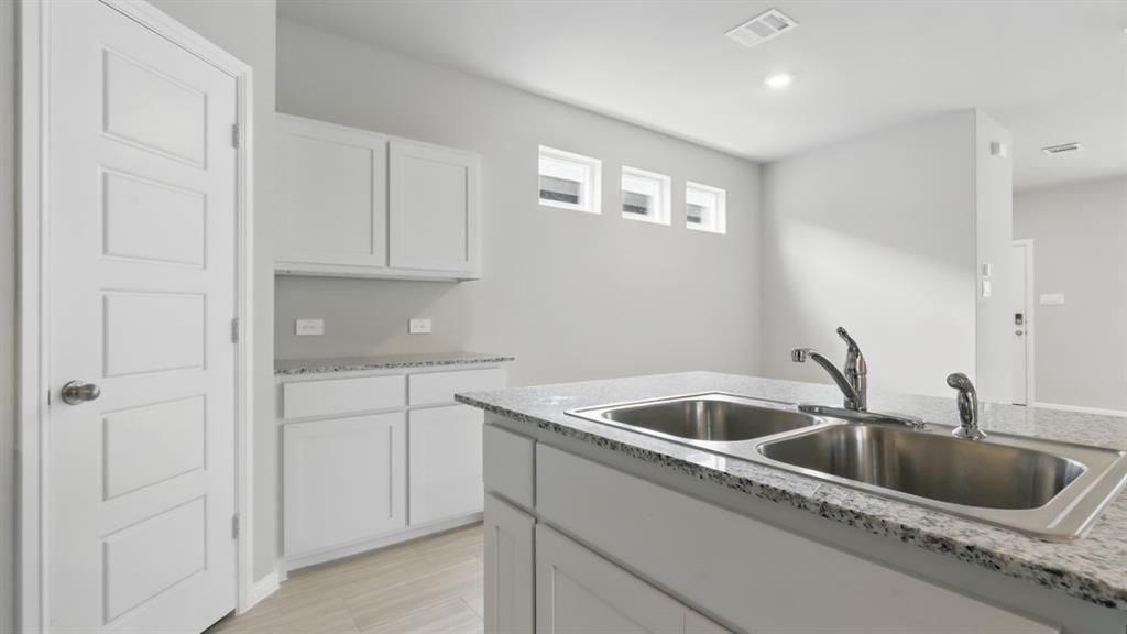 3149 Maple Orch Lane Fort Worth, TX 76140 - Photo 5 of 39 a kitchen that has a sink and cabinets