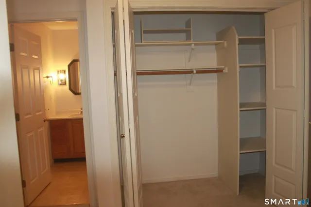 a bathroom with a sink vanity and mirror