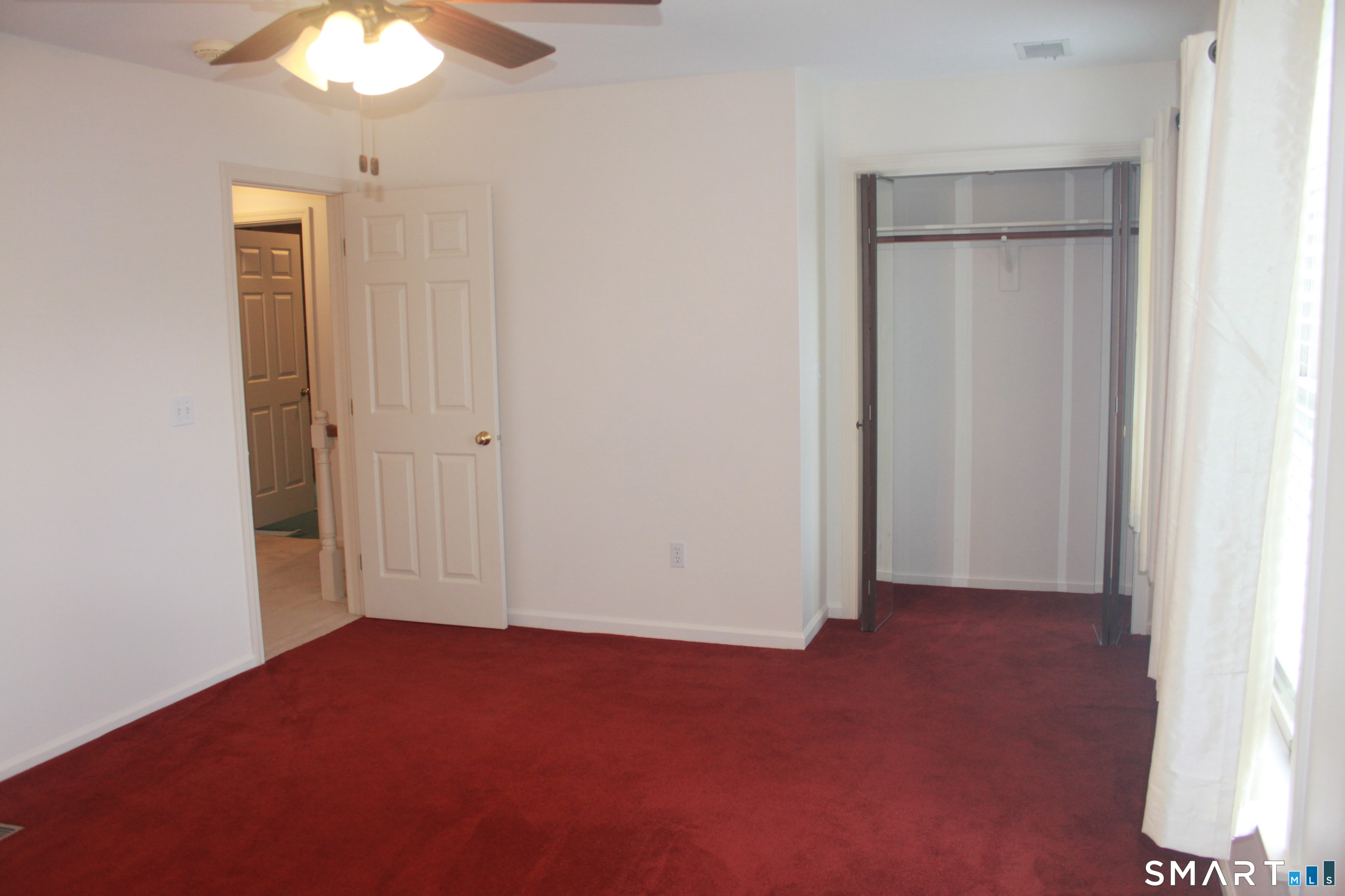 15 Downing Way, Unit 15 Suffield, CT 06078 - Photo 17 of 26 an empty room with closet area