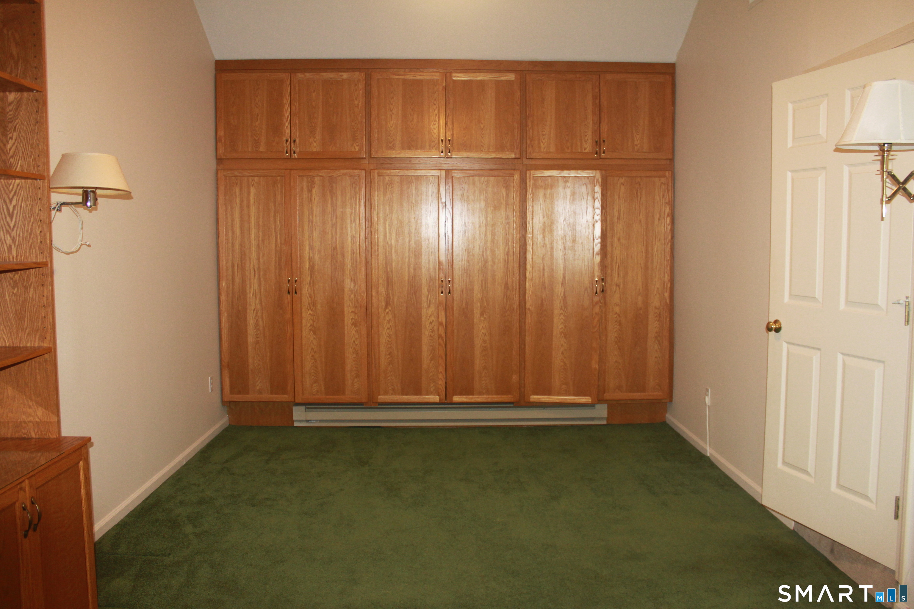 15 Downing Way, Unit 15 Suffield, CT 06078 - Photo 19 of 26 a view of an empty room with wooden walls
