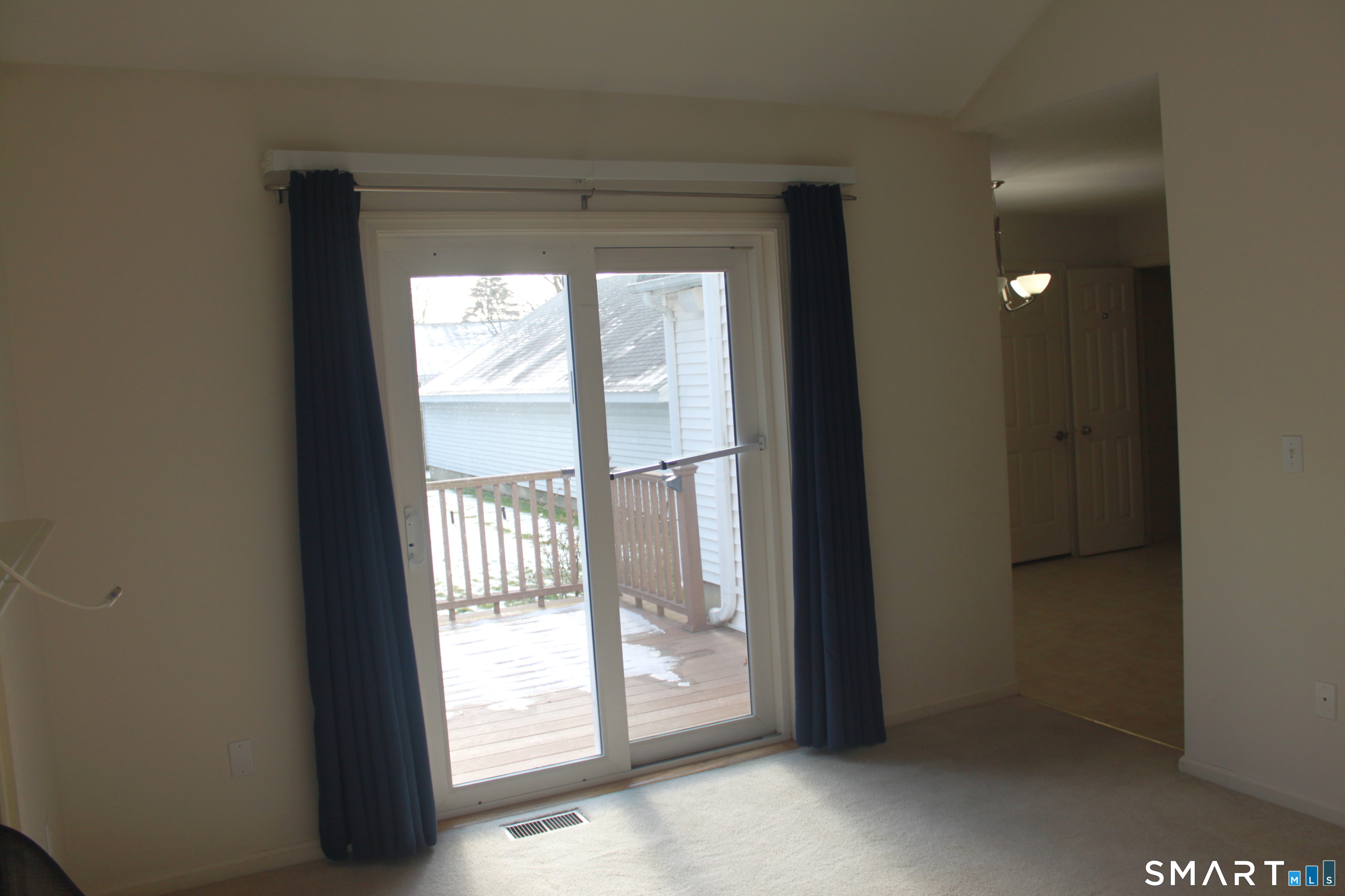 15 Downing Way, Unit 15 Suffield, CT 06078 - Photo 8 of 26 a view of an empty room and window