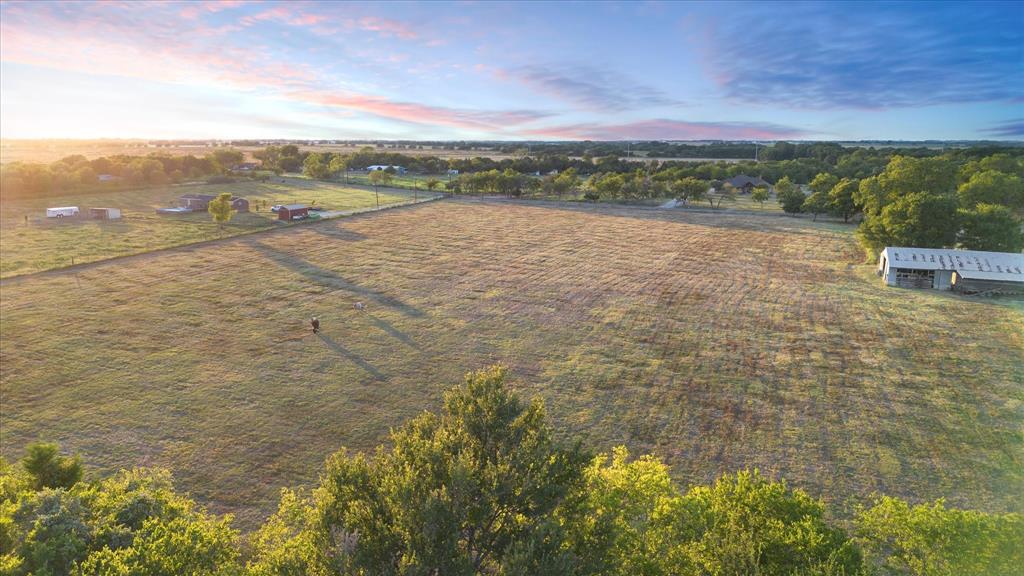 Tbd Holder Road Waxahachie, TX 75165 - Photo 19 of 24 Expansive agricultural land featuring a barn structure and perimeter fencing