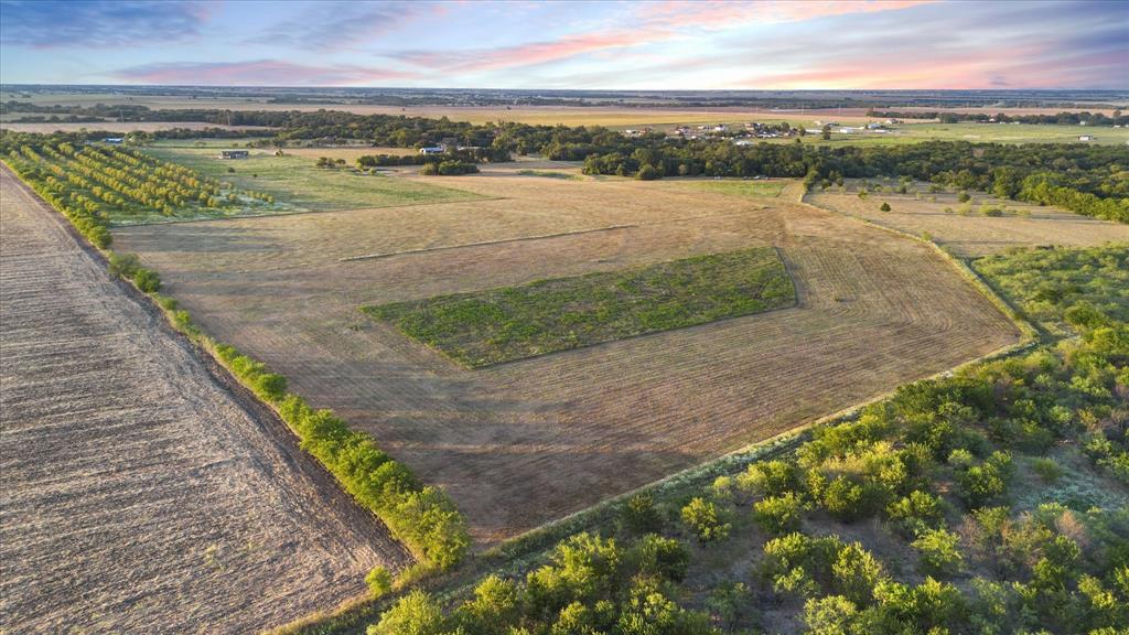 Tbd Holder Road Waxahachie, TX 75165 - Photo 8 of 24 Expansive agricultural property featuring cultivated fields and a treelined perimeter