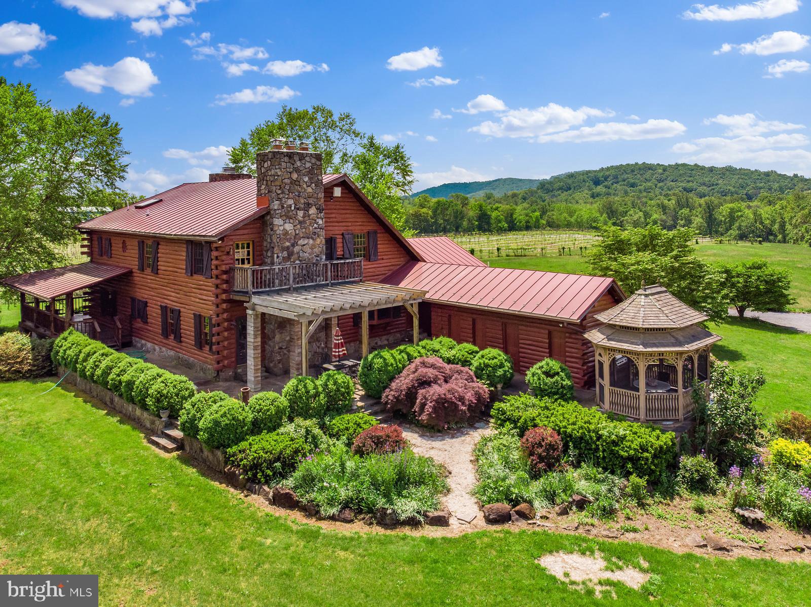 14249 Hume Road Hume, VA 22639 - Photo 1 of 48 a front view of a house with a yard