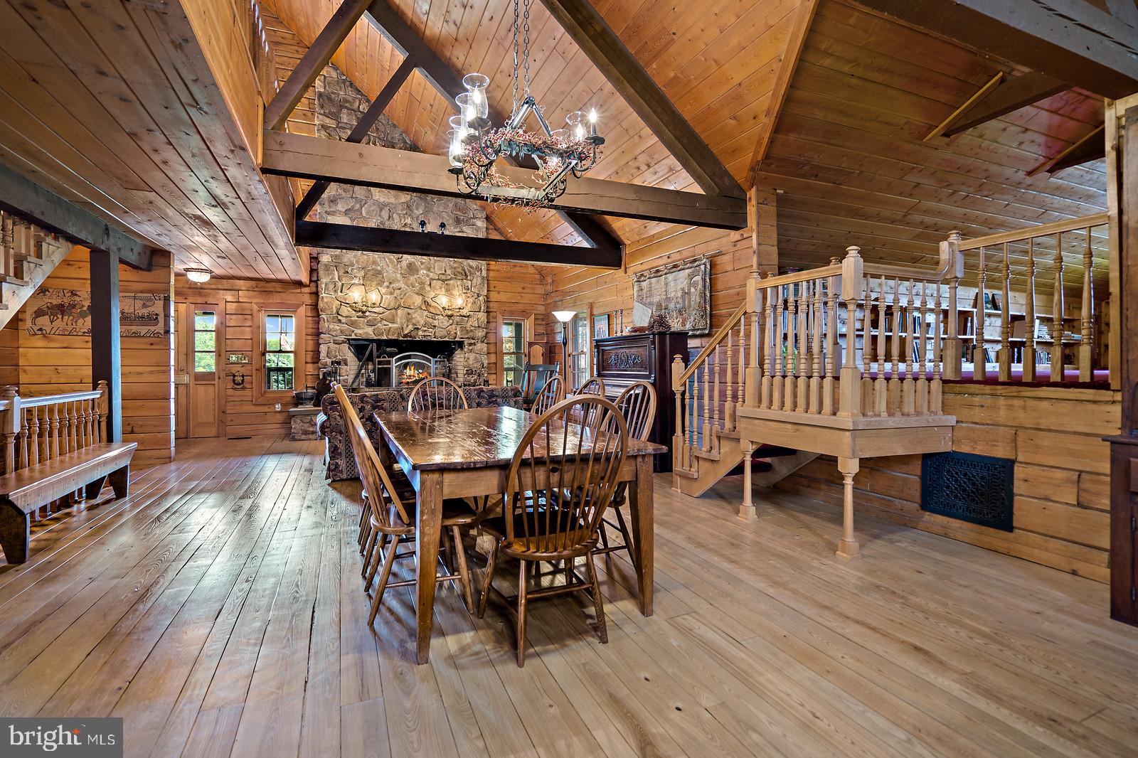 14249 Hume Road Hume, VA 22639 - Photo 12 of 48 a dining room with furniture wooden floor and a rug
