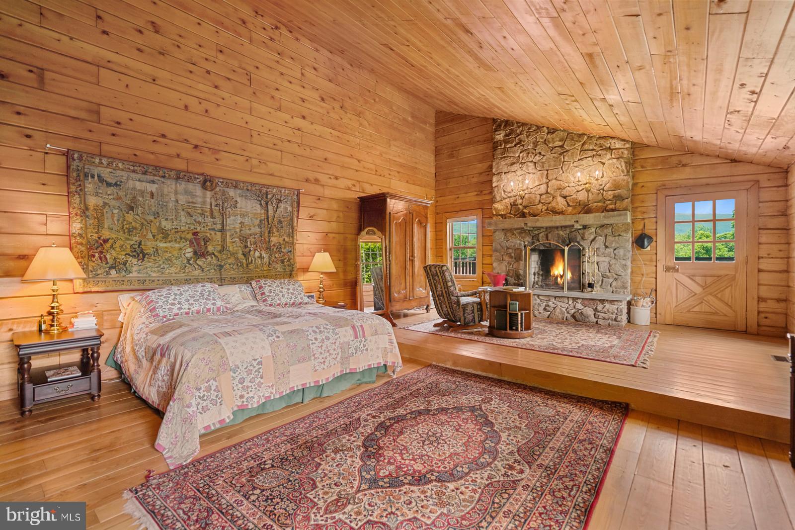 14249 Hume Road Hume, VA 22639 - Photo 17 of 48 a spacious bedroom with a large bed and a dresser