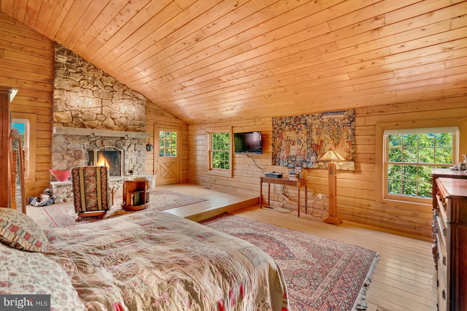 14249 Hume Road Hume, VA 22639 - Photo 18 of 48 a bed room with a bed and a television