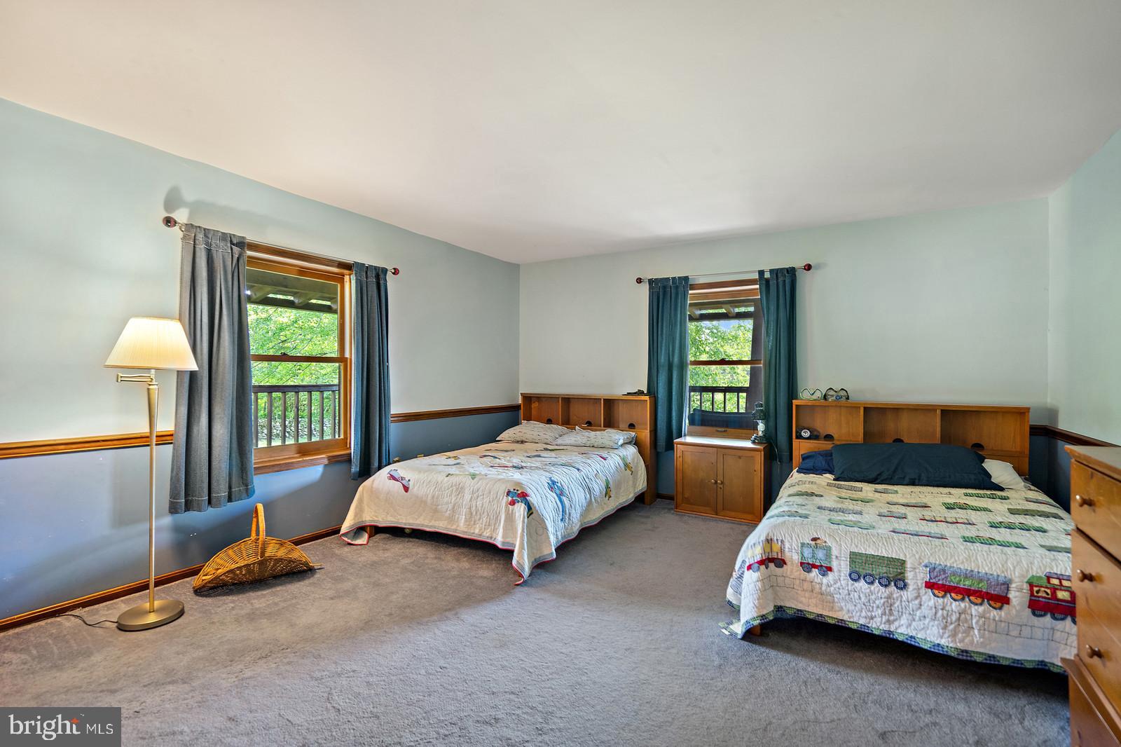 14249 Hume Road Hume, VA 22639 - Photo 24 of 48 a bedroom with two beds and a window