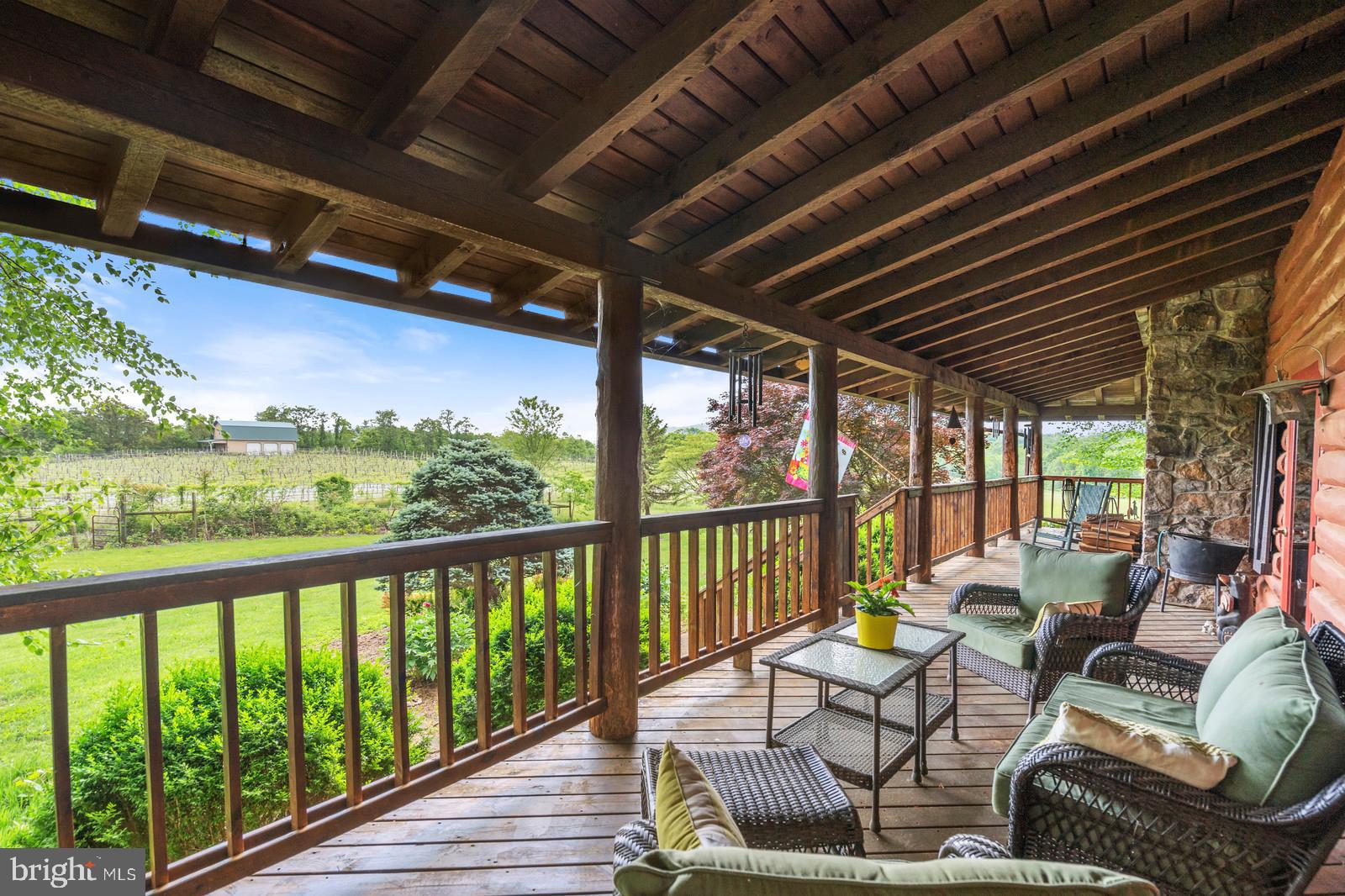 14249 Hume Road Hume, VA 22639 - Photo 34 of 48 a view of a chairs in wooden deck