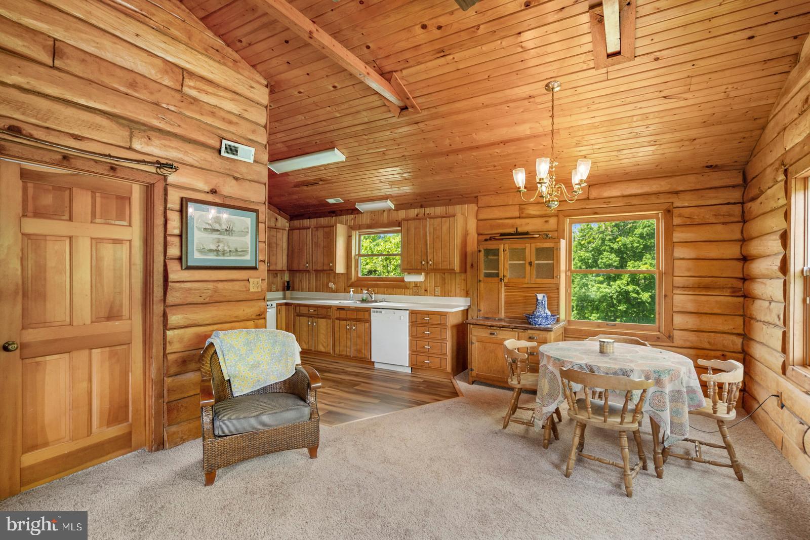 14249 Hume Road Hume, VA 22639 - Photo 41 of 48 a outdoor space with patio the couches and chairs with wooden floor