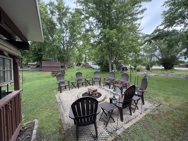 2795 East 28th Road Marseilles, IL 61341 - Photo 33 of 91 a view of a patio with a table chairs and a backyard