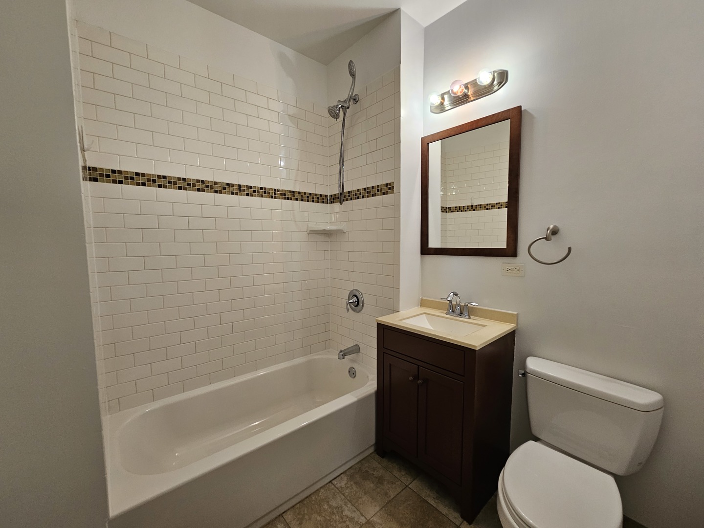 2000 South Ashland Avenue, Unit 1 Chicago, IL 60608 - Photo 15 of 23 a bathroom with a toilet sink vanity tub and mirror