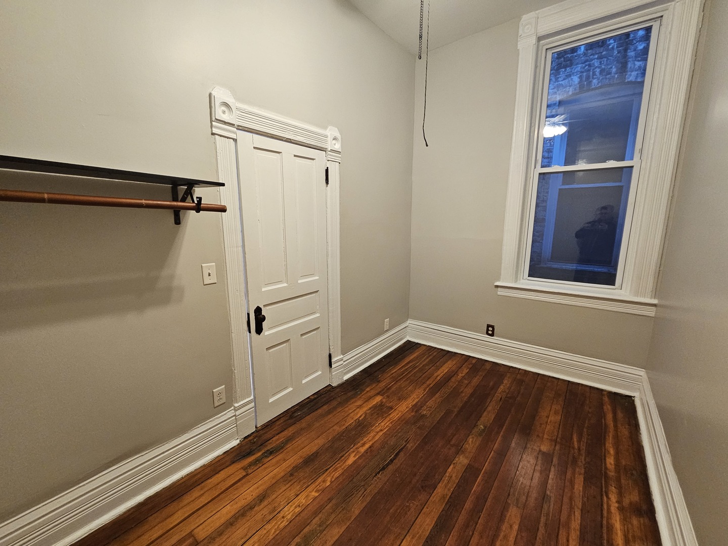 2000 South Ashland Avenue, Unit 1 Chicago, IL 60608 - Photo 19 of 23 a view of a room with wooden floor and white walls