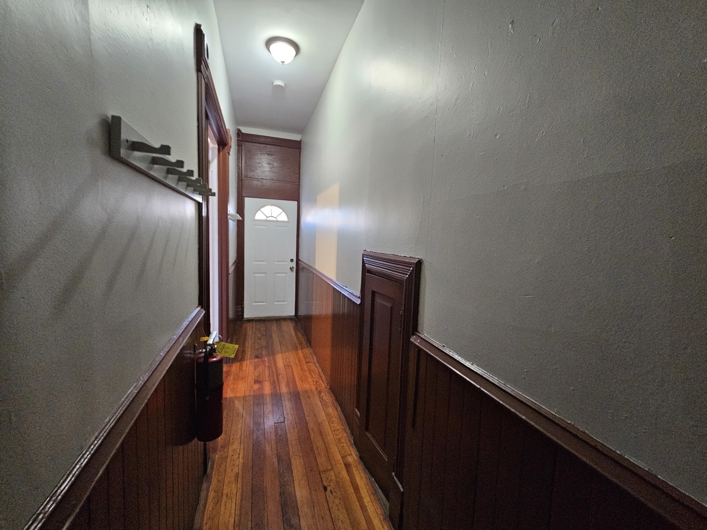 2000 South Ashland Avenue, Unit 1 Chicago, IL 60608 - Photo 3 of 23 a view of a hallway with wooden floor