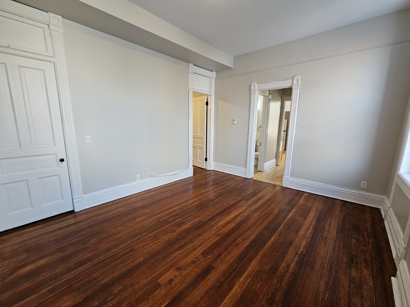 2000 South Ashland Avenue, Unit 1 Chicago, IL 60608 - Photo 7 of 23 a view of an empty room with wooden floor and closet