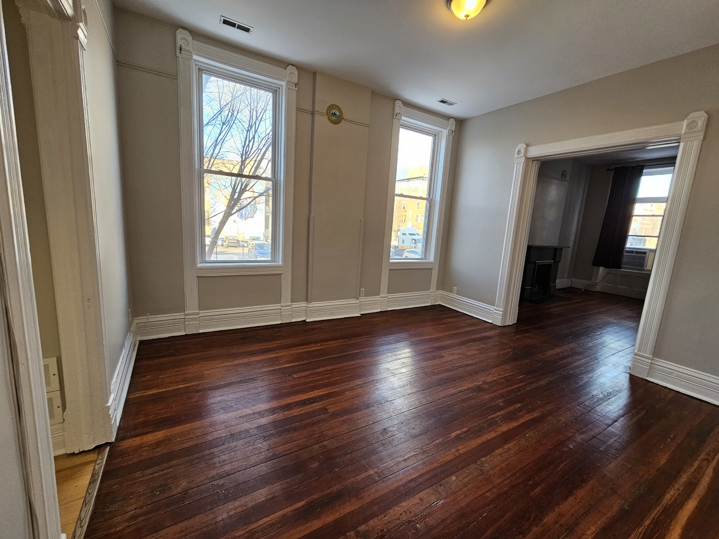 2000 South Ashland Avenue, Unit 1 Chicago, IL 60608 - Photo 8 of 23 an empty room with wooden floor and windows