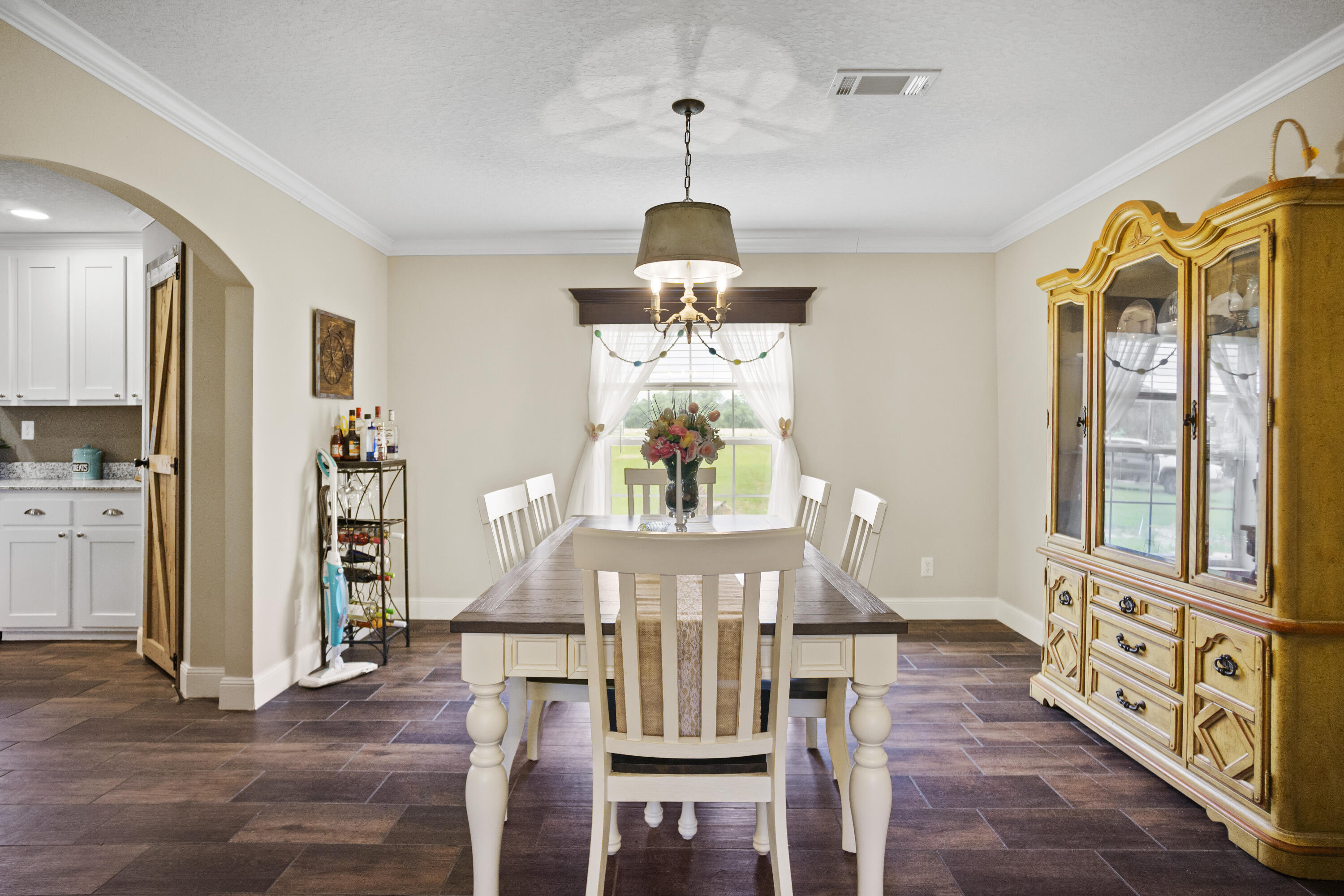 1834 Carr Road Chipley, FL 32428 - Photo 6 of 26 a view of a dining room with furniture window and wooden floor