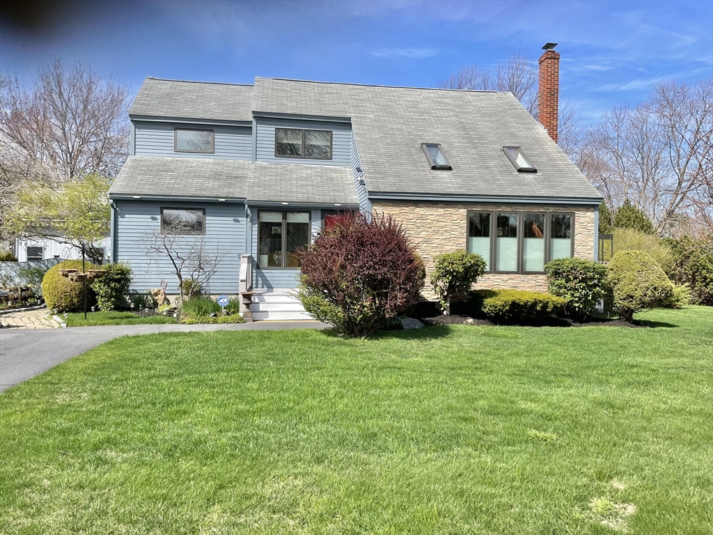 16 Howard Avenue Wells, ME 04090 - Photo 1 of 35 a front view of a house with garden