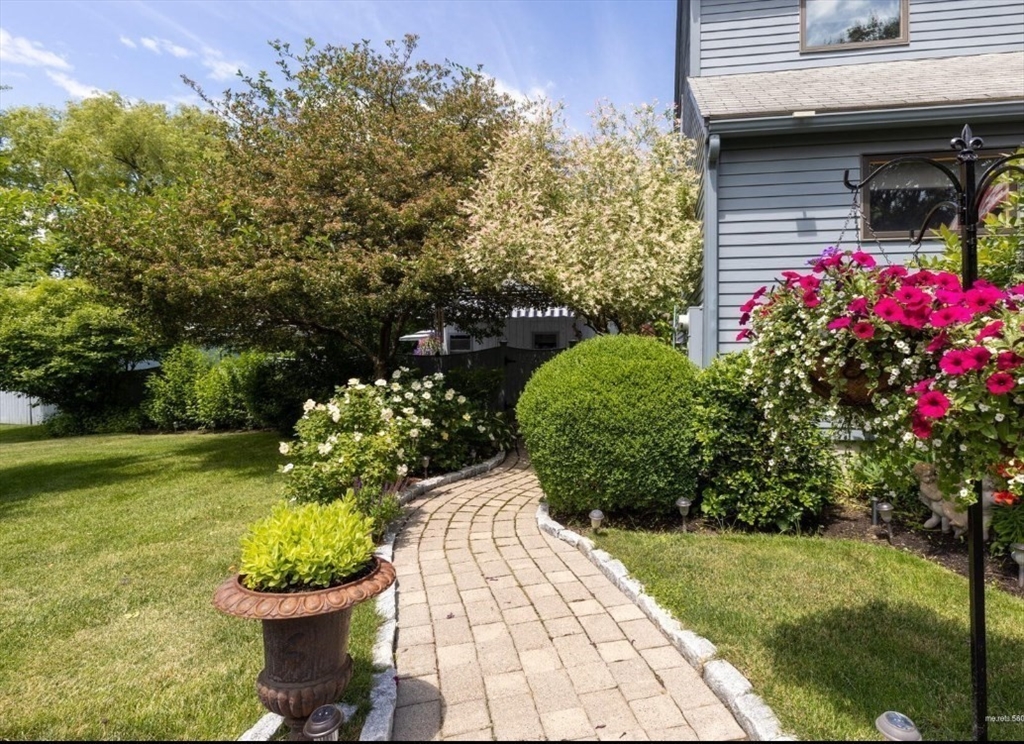 16 Howard Avenue Wells, ME 04090 - Photo 18 of 35 a flower garden with a flower garden