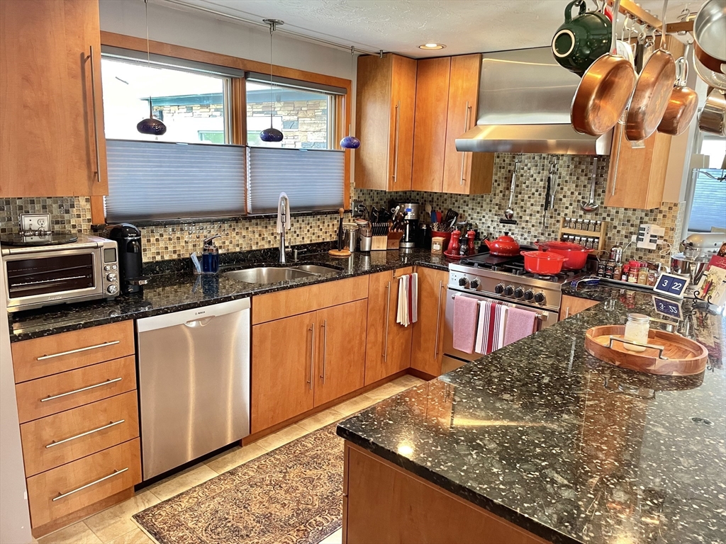 16 Howard Avenue Wells, ME 04090 - Photo 2 of 35 a kitchen with stainless steel appliances granite countertop a sink stove and cabinets