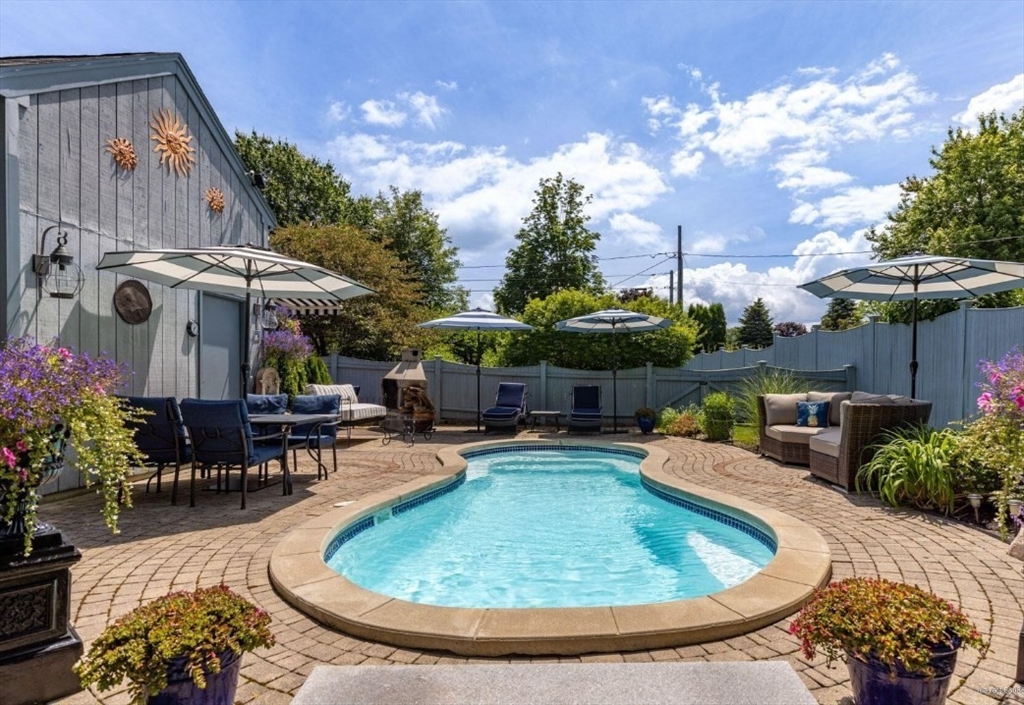 16 Howard Avenue Wells, ME 04090 - Photo 21 of 35 a view of a swimming pool with sitting area