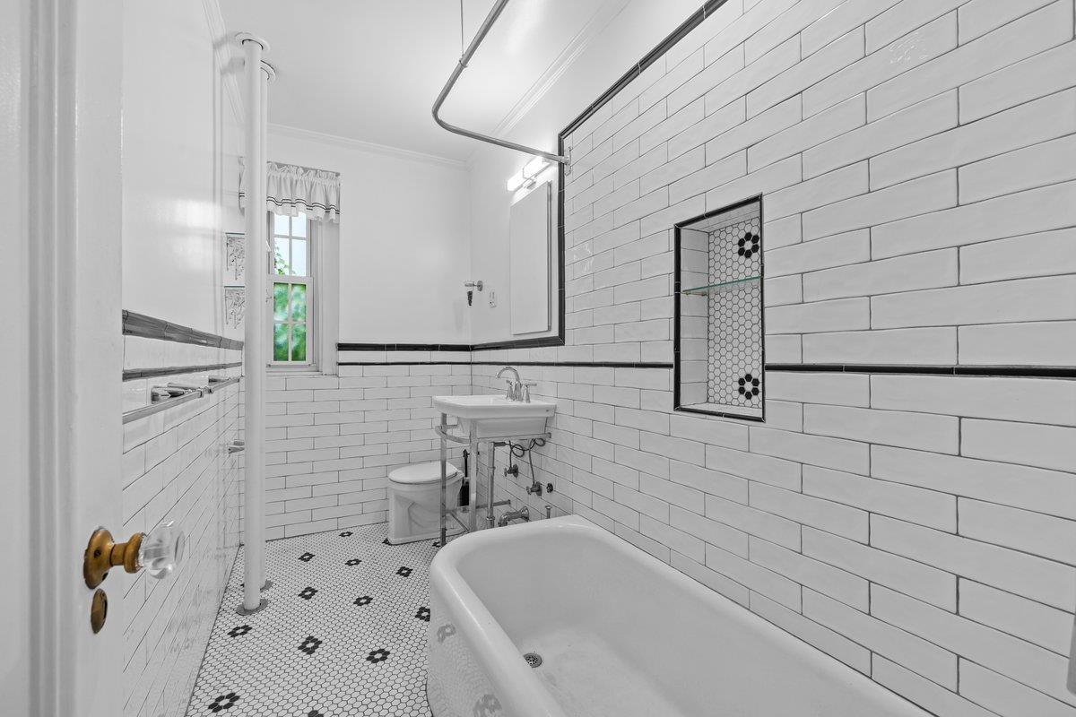 525 West 238th Street, Unit 1L Bronx, NY 10463 - Photo 11 of 20 a bathroom with a sink a toilet and shower