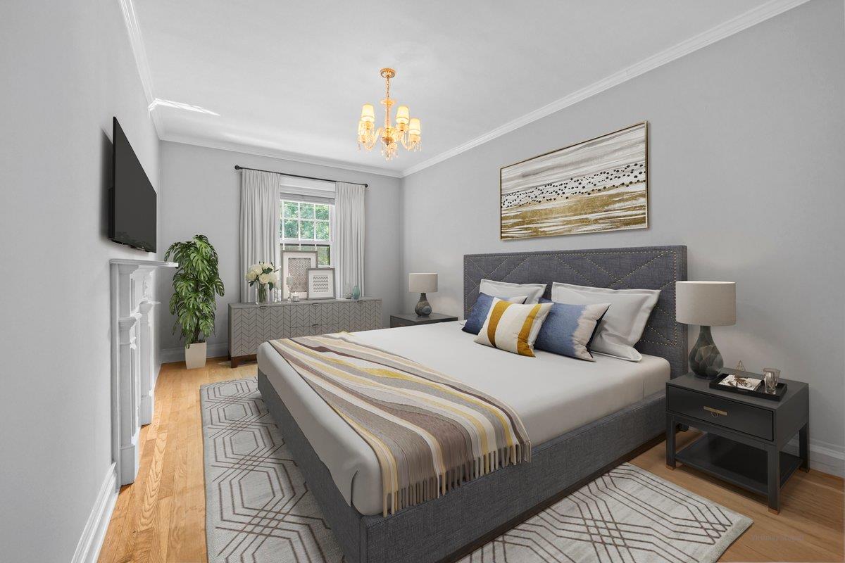 525 West 238th Street, Unit 1L Bronx, NY 10463 - Photo 12 of 20 a bedroom with a bed and a chandelier